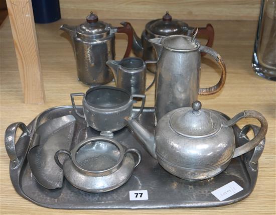A Tudric hammered pewter tea set including tray, a period pewter 3 piece tea set crumb scoop and teapot